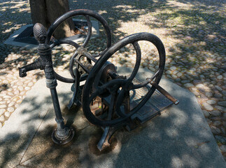 Historic hand pump in shade of trees, Market Square (Rynek). Stary Sącz, Poland.