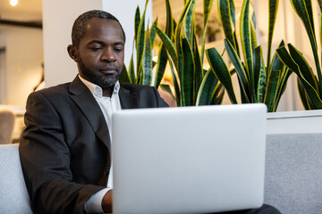 African american businessman working in the office and looking busy
