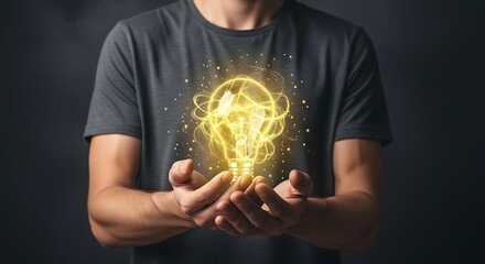 A person holds a glowing lightbulb graphic in their hands, symbolizing an idea or innovation.