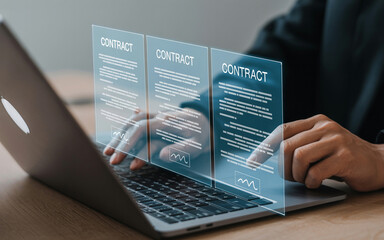 Person using laptop to review and sign digital contracts for business agreements and online legal transactions