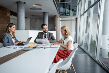 Business people working together in modern office meeting room