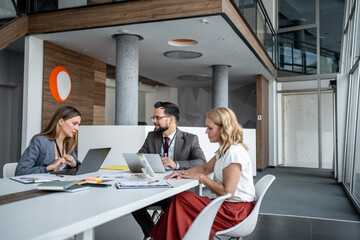 Business people working together on project in modern office