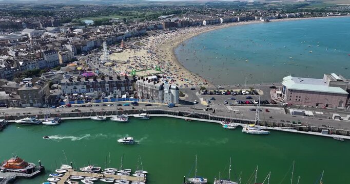 Busy and Sunny Beach in Weymouth in the Summer