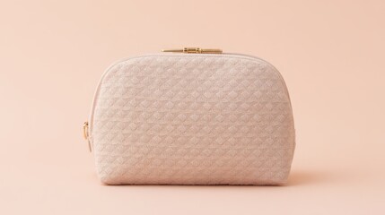 An elegant pink cosmetic bag placed on a soft gradient background, embodying simplicity and style.
