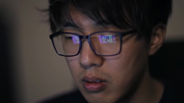  Programmer Working Late at Night with Code Reflections on Glasses
