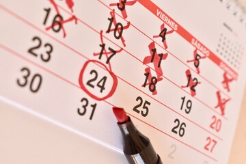 Countdown calendar with red crosses and circled date. Planning for an important moment. The...