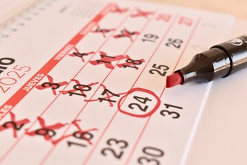 Countdown calendar with red crosses and circled date. Planning for an important moment. The...