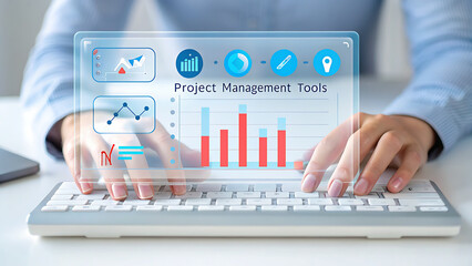 Hands typing on keyboard interacting with digital interface displaying charts and graphs futuristic
