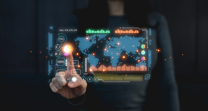 A person interacts with a futuristic digital interface displaying a world map, data charts, and analytics in a dark, high-tech environment.