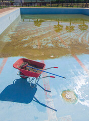 Wheelbarrow at pool bottom