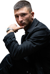 Young successful stylish man. Classical portrait of a businessman dressed in a jacket with a watch...