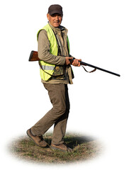 Mature man hunter with gun while walking on field.