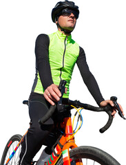 Cyclist riding bicycle on road against clear sky. A man in an outfit stands with a bicycle on an...