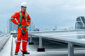 Technician or factory worker man stand near solar cell panel to  maintenance rooftop solar cell...