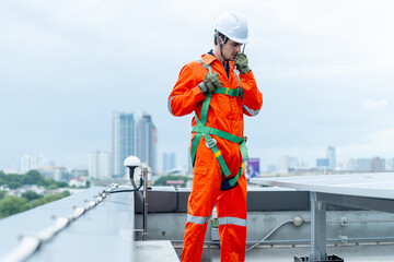 Professional technician worker or engineer use walkie-talkie to discuss with co-worker near solar...