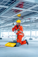 Vertical image side view of professional technician worker or engineer use tools for maintenance or...