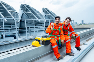Two engineer or technician worker sit together to relax after finish their work and look at camera...