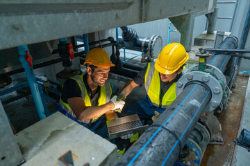 High veiw  of engineer or technician worker check valve system of factory building also stay under...