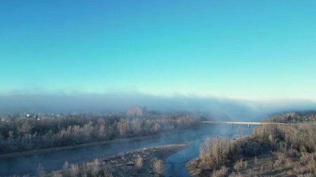 xa drone aerial view over sunrise on a foggy morning is highly atmospheric and cinematic, perfect for stock platforms, Drone Aerial View of Sunrise Over Foggy Landscape &ndash; Peaceful Morning Atmosphere