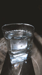 A glass of water on a table 