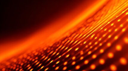 Abstract tech background with glowing red dots and selective focus on a dark surface.