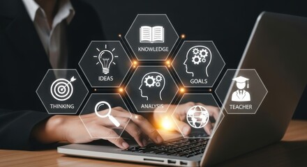 Businesswoman using laptop with knowledge and education icons
