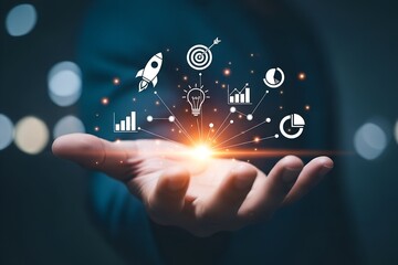 Business growth and success concept with a hand holding a glowing light bulb connected to icons representing strategy and progress