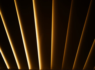 Diagonal dramatic blinds during sunset interior