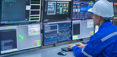 Engineer working at control room, Manager control system, Technician man monitoring program from a...