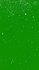 Falling white specks on a green background