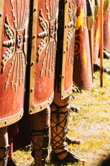 shields of the Roman legionaries in defensive formation at a historical reenactment festival.