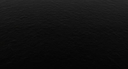 Close up abstract background texture of dark rough surface with fine grain detail
