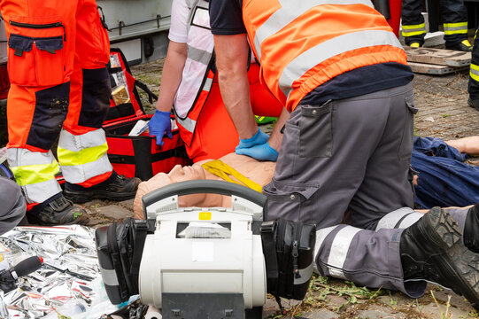 Resuscitation with emergency equipment and professional rescue team – realistic training scenario. Emergency medicine and teamwork in time-critical situations – response, technique, and communication