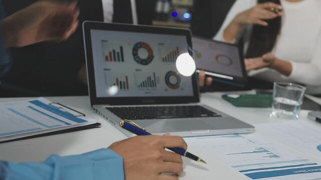 Business finance and budget management, Businessman using calculator and analyzing invoices and tax documents to manage company finances, Budget, Monthly expenses on desk with documents and reports.