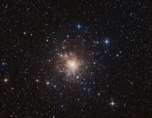 astronomical photograph of a dense glowing star cluster in space