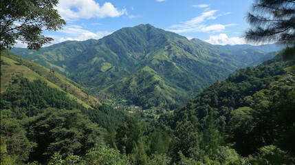 Obraz premium A breathtaking panoramic view of lush green mountains stretching into the distance under a vast blue sky, showcasing nature's majestic beauty and serene tranquility