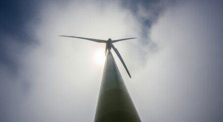 An authentic photograph of wind turbines in a foggy landscape