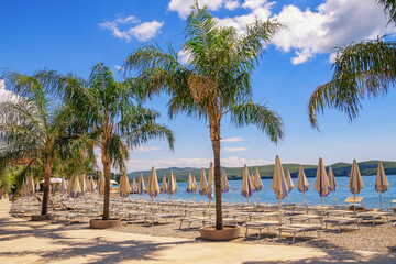 Summer beach vacation. Sunny Mediterranean landscape. Montenegro, Bay of Kotor. Beach in Tivat city...