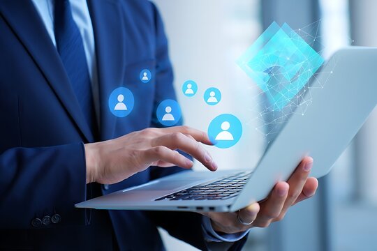 Businessman interacting with digital interface displaying people icons and network connections on a laptop representing data management and global connectivity