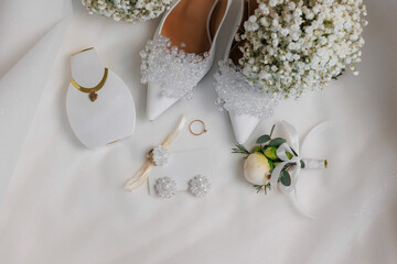 Elegant bridal accessories and wedding details on a white background