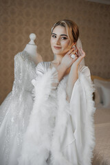 Beautiful bride preparing for wedding day in elegant bridal gown setting