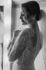 Elegant bride enjoying a moment in front of a vanity before the wedding ceremony