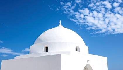 White dome mosque against a vibrant blue sky