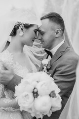 Couple shares a tender moment during wedding ceremony in soft, romantic style
