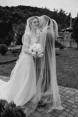 Couple shares a romantic moment during their outdoor wedding ceremony in a scenic location