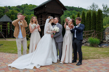 Outdoor wedding ceremony with joyful guests celebrating a couple's special moment