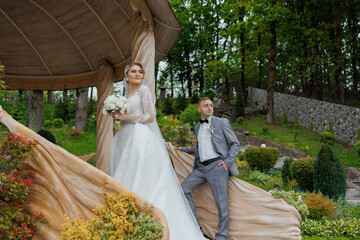 Couple celebrates their wedding day in a beautiful garden venue surrounded by nature