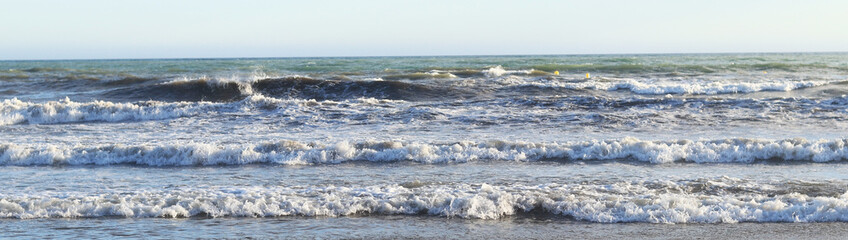 Waves on the sea. Banner. Photo of seascape. Waves with white foam. Natural background. Concept of...