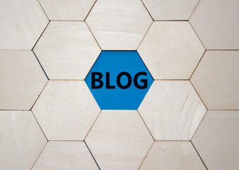 Blog symbol. Concept word Blog on wooden comb puzzle. Beautiful blue background. Business and Blog...