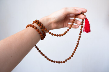  Japamala on the hand. Prayer beads. Religious equipment